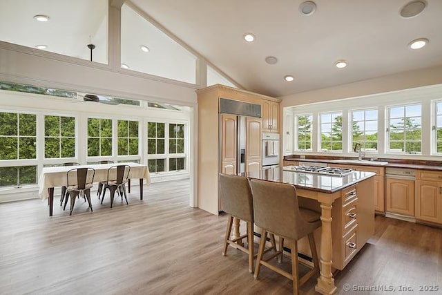 2 Aspetuck Hill Ln, Weston, CT 06883 - kitchen with a sink, white oven, a kitchen island, stainless steel gas stovetop, and light brown cabinetry
