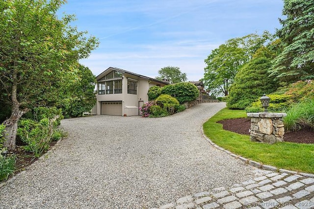 2 Aspetuck Hill Ln, Weston, CT 06883 - view of front of house with driveway and an attached garage
