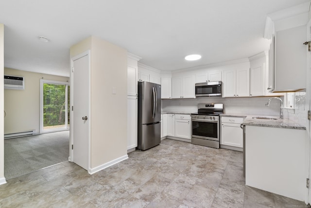 63 Summit St Apt 16, Manchester, CT 06040 - kitchen with appliances with stainless steel finishes, baseboard heating, a sink, and white cabinets