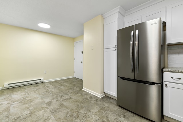 63 Summit St Apt 16, Manchester, CT 06040 - kitchen with freestanding refrigerator, a baseboard heating unit, white cabinets, and baseboards