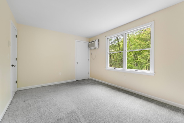 63 Summit St Apt 16, Manchester, CT 06040 - carpeted spare room featuring an AC wall unit and baseboards