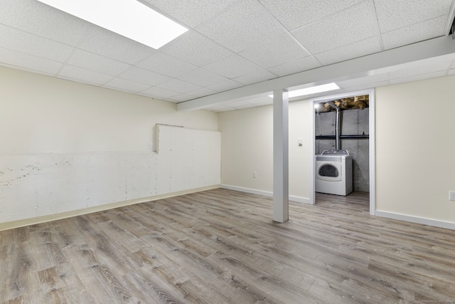 63 Summit St Apt 16, Manchester, CT 06040 - finished below grade area with washer / clothes dryer, wood finished floors, baseboards, and a paneled ceiling