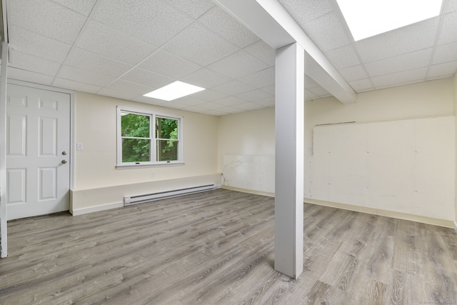 63 Summit St Apt 16, Manchester, CT 06040 - below grade area with a baseboard radiator, a drop ceiling, wood finished floors, and baseboards