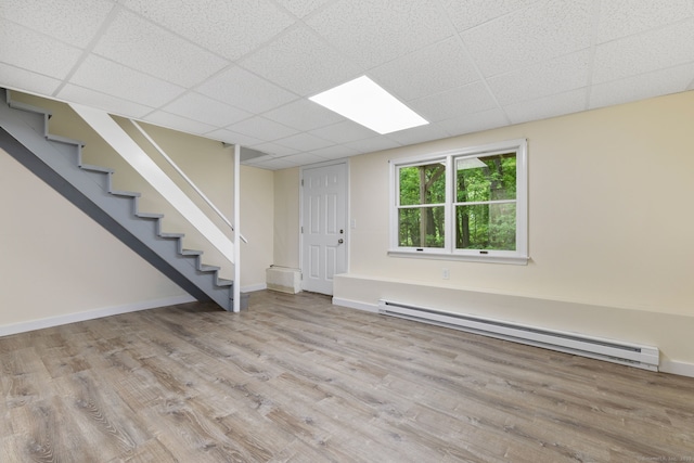 63 Summit St Apt 16, Manchester, CT 06040 - entryway featuring baseboard heating, wood finished floors, stairway, baseboards, and a drop ceiling
