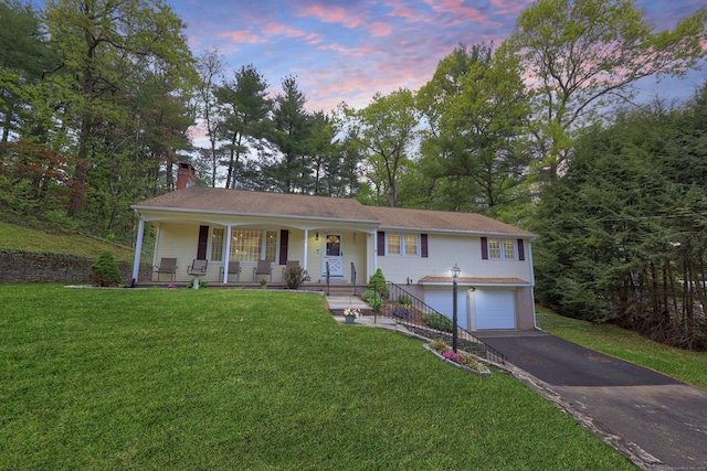 108 Fox Den Rd, Bristol, CT 06010 - ranch-style house with a porch, asphalt driveway, a garage, a chimney, and a front lawn