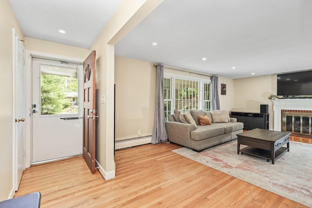 108 Fox Den Rd, Bristol, CT 06010 - living area featuring baseboard heating, light wood-type flooring, a brick fireplace, and recessed lighting