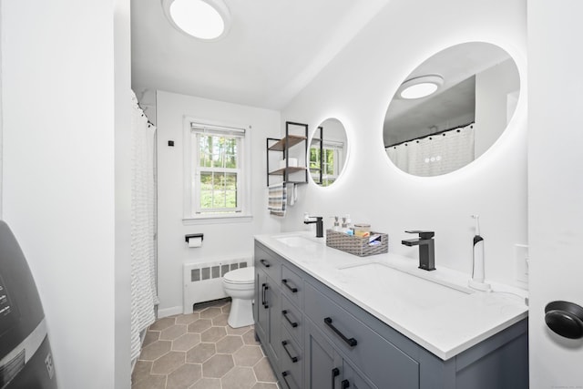108 Fox Den Rd, Bristol, CT 06010 - full bathroom featuring radiator heating unit, toilet, tile patterned floors, double vanity, and baseboards