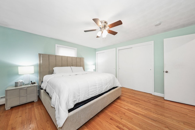 108 Fox Den Rd, Bristol, CT 06010 - bedroom with multiple closets, wood finished floors, and ceiling fan