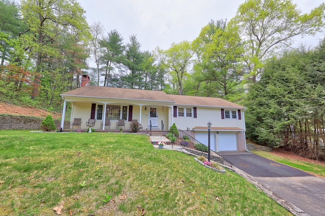 108 Fox Den Rd, Bristol, CT 06010 - ranch-style home with covered porch, a garage, asphalt driveway, a chimney, and a front lawn