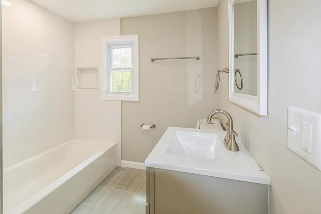 bathroom with baseboards and vanity
