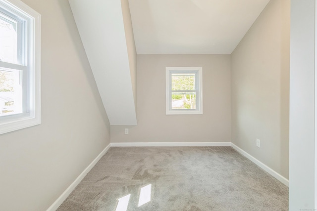 unfurnished room featuring carpet flooring and baseboards