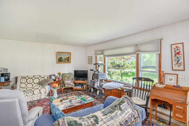 living area featuring wallpapered walls