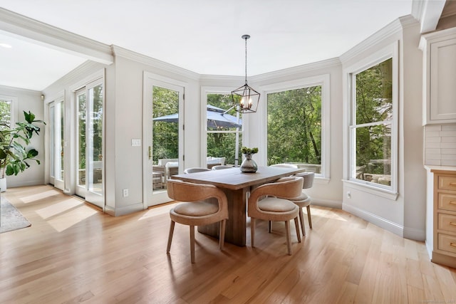 681 Old Stamford Rd, New Canaan, CT 06840 - dining space featuring a chandelier, baseboards, light wood-style floors, and ornamental molding