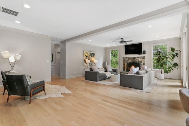 681 Old Stamford Rd, New Canaan, CT 06840 - living room featuring a stone fireplace, baseboards, light wood-style floors, ceiling fan, and ornamental molding