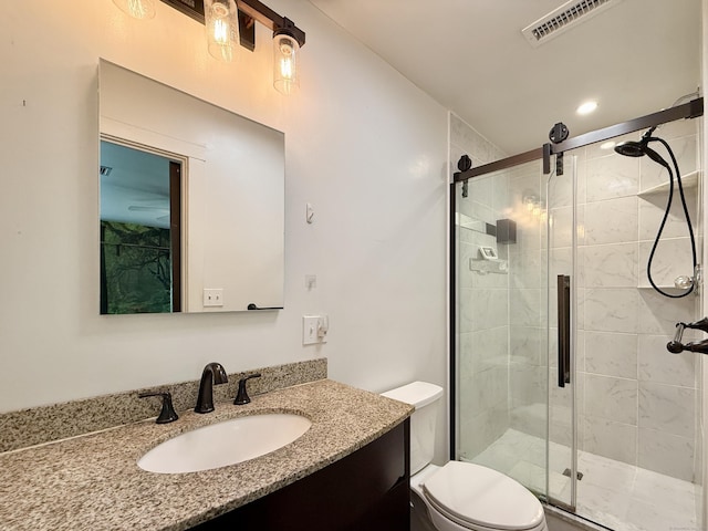 full bath with toilet, a shower stall, and vanity
