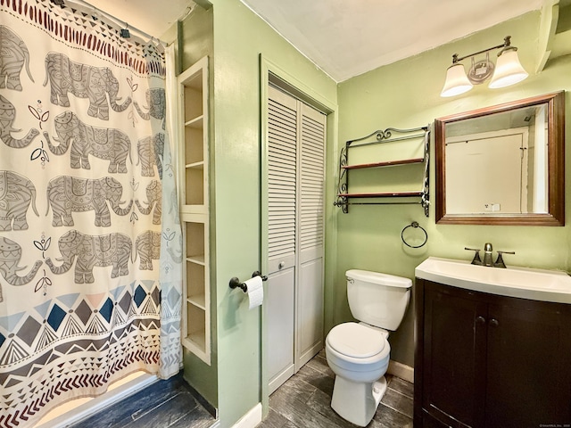 full bathroom with toilet, vanity, wood finished floors, and a shower with curtain