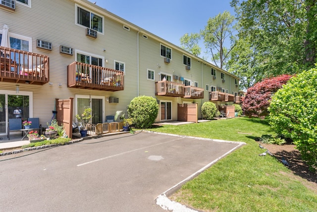 30 Elmcroft Rd Apt 12, Stamford, CT 06902 - back of property featuring uncovered parking and a yard