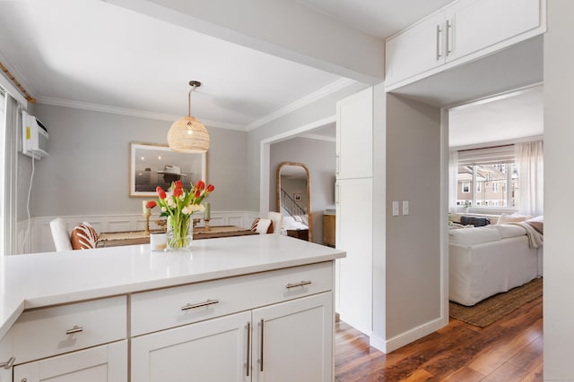 30 Elmcroft Rd Apt 12, Stamford, CT 06902 - kitchen featuring wood finished floors, light countertops, white cabinets, and crown molding
