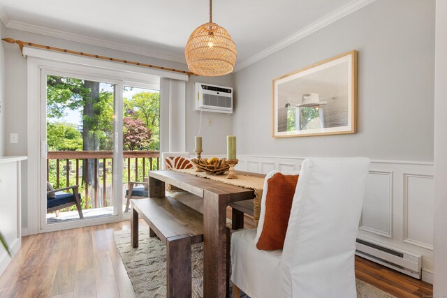 30 Elmcroft Rd Apt 12, Stamford, CT 06902 - dining space featuring baseboard heating, a decorative wall, crown molding, a wall mounted air conditioner, and wood finished floors