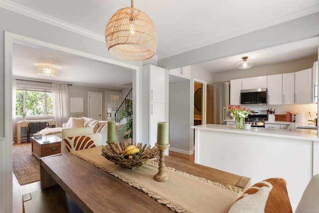 30 Elmcroft Rd Apt 12, Stamford, CT 06902 - dining space featuring crown molding and light wood finished floors