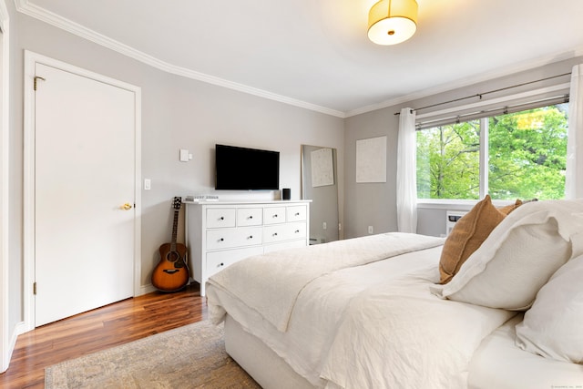 30 Elmcroft Rd Apt 12, Stamford, CT 06902 - bedroom with wood finished floors, crown molding, and baseboards