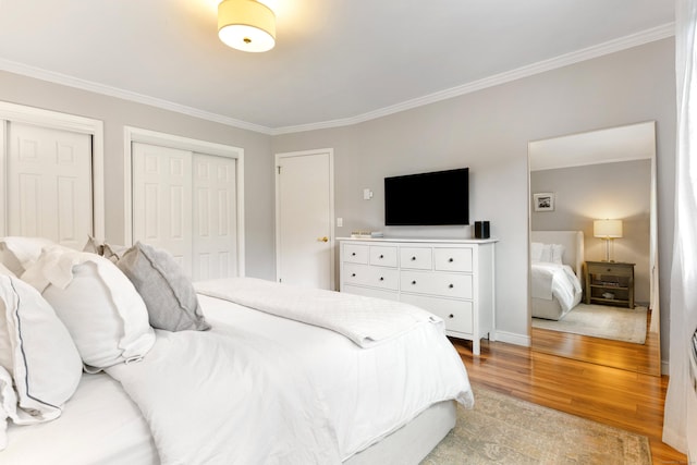 30 Elmcroft Rd Apt 12, Stamford, CT 06902 - bedroom featuring light wood-type flooring, ornamental molding, multiple closets, and baseboards