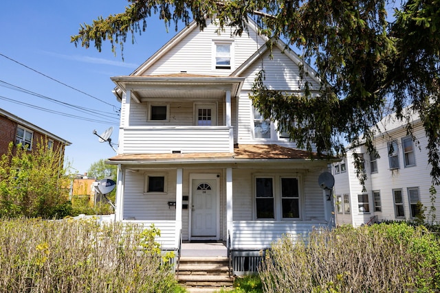 view of front of house with a balcony and a porch