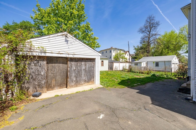 view of patio with a garage and an outdoor structure