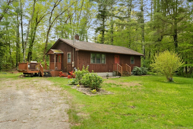 200 Preston City Rd, Voluntown, CT 06384 - view of front of house featuring a chimney, a deck, a front yard, and roof with shingles