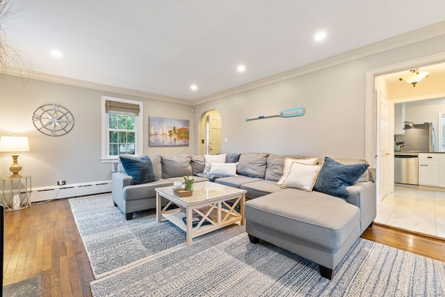 85 5th St, Stamford, CT 06905 - living room with baseboard heating, arched walkways, wood finished floors, ornamental molding, and recessed lighting