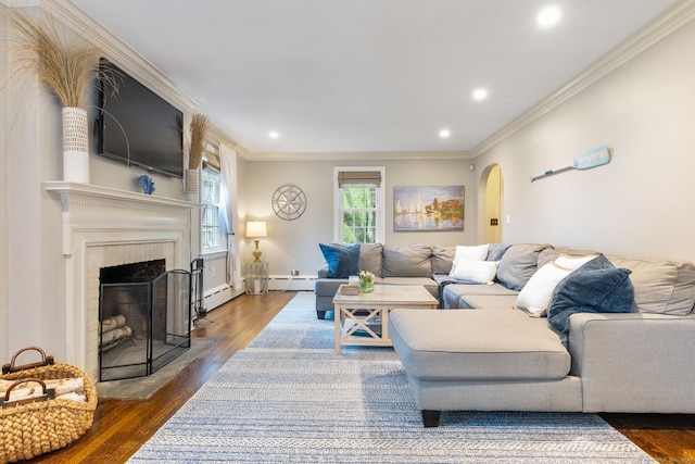 85 5th St, Stamford, CT 06905 - living room featuring arched walkways, dark wood-type flooring, a baseboard heating unit, ornamental molding, and recessed lighting
