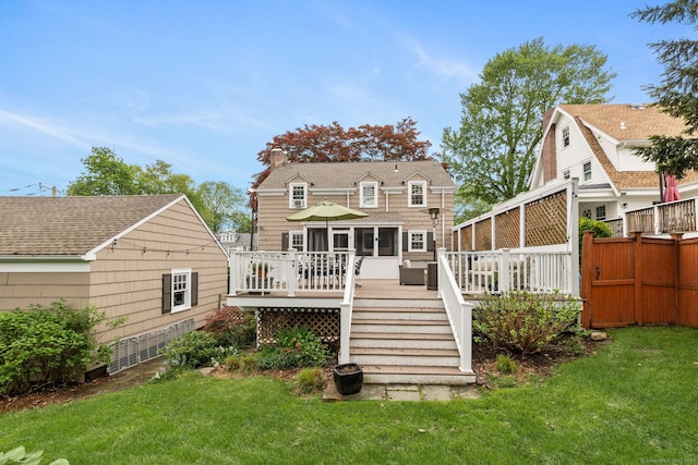 85 5th St, Stamford, CT 06905 - rear view of house with a deck, a chimney, and a shingled roof