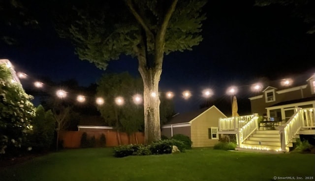 85 5th St, Stamford, CT 06905 - yard at night featuring a deck, a yard, and stairway