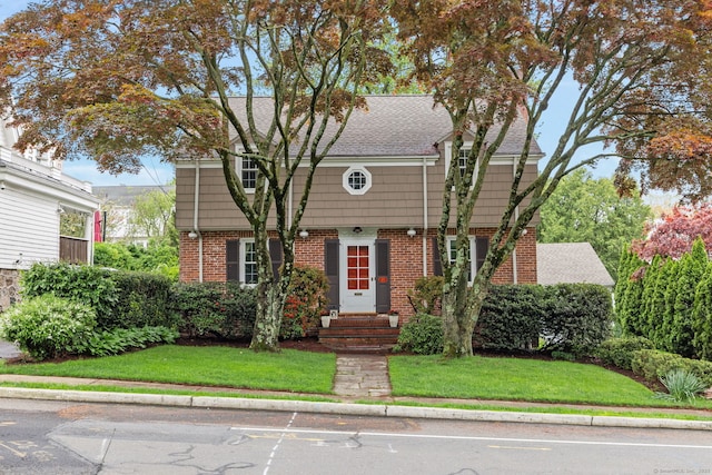 85 5th St, Stamford, CT 06905 - colonial house with a front lawn and brick siding