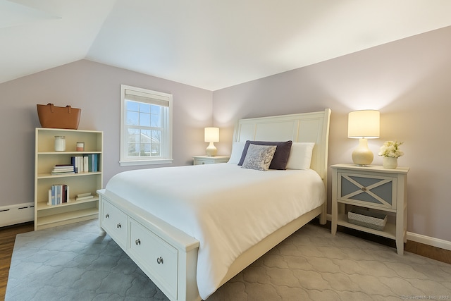 85 5th St, Stamford, CT 06905 - bedroom featuring lofted ceiling, wood finished floors, baseboards, and a baseboard radiator
