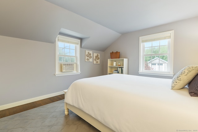 85 5th St, Stamford, CT 06905 - bedroom featuring wood finished floors, vaulted ceiling, multiple windows, baseboards, and cooling unit
