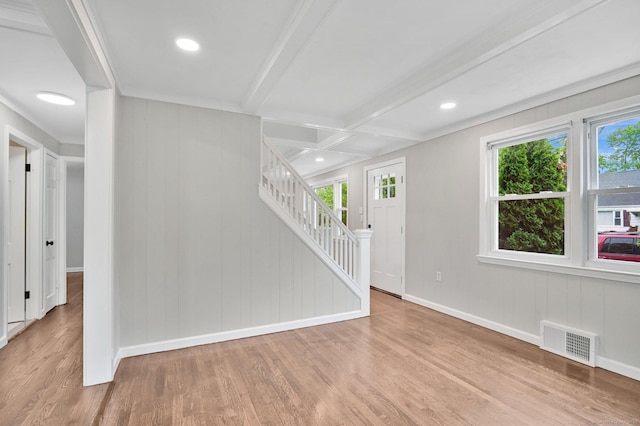 unfurnished living room featuring wood finished floors, stairway, baseboards, beamed ceiling, and recessed lighting