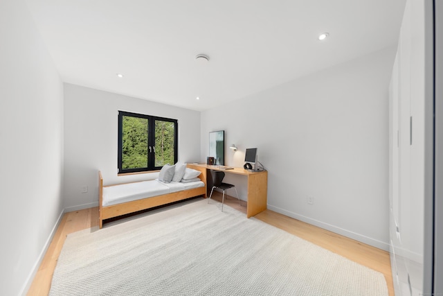 bedroom with wood finished floors, baseboards, a desk, and recessed lighting