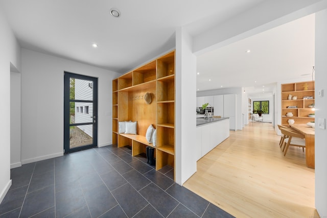 mudroom with recessed lighting and tile patterned floors
