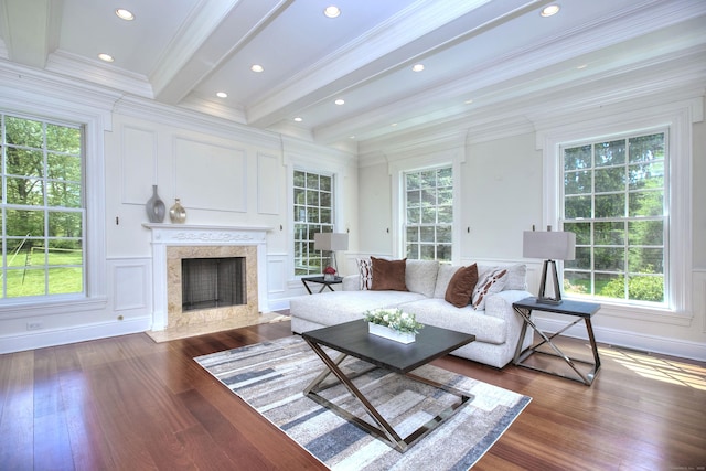 88 Merry Meet Cir, Fairfield, CT 06824 - living area with a decorative wall, dark wood-style flooring, a fireplace, crown molding, and beam ceiling