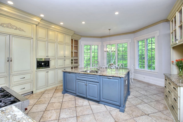 88 Merry Meet Cir, Fairfield, CT 06824 - kitchen featuring cream cabinets, a sink, stone tile flooring, blue cabinets, and baseboards