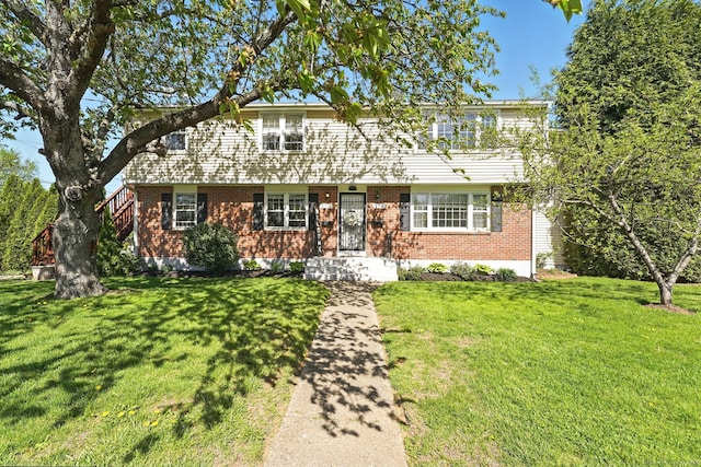176-178 Wolcott Hill Rd, Wethersfield, CT 06109 - view of front of house with brick siding and a front lawn