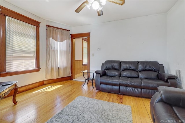19 5th St, Ansonia, CT 06401 - living area with light wood-type flooring, a ceiling fan, baseboards, and plenty of natural light