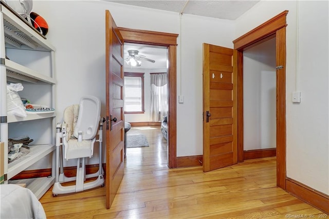19 5th St, Ansonia, CT 06401 - hallway with light wood-type flooring, an office area, and baseboards