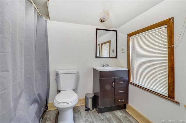 19 5th St, Ansonia, CT 06401 - full bath with wood finished floors, toilet, baseboards, and vanity