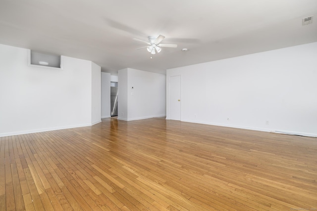 37 Greenwich Ave Apt 1-2, Stamford, CT 06902 - empty room with ceiling fan, light wood-style floors, and baseboards