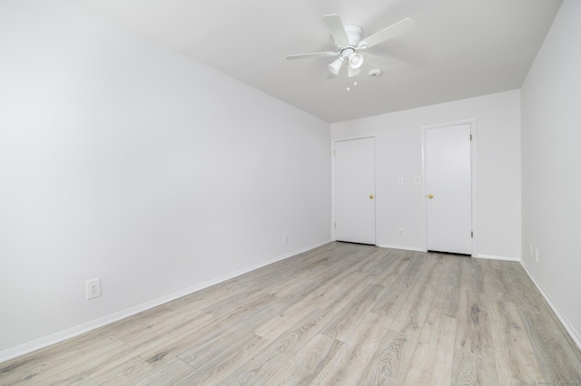 37 Greenwich Ave Apt 1-2, Stamford, CT 06902 - unfurnished bedroom with light wood-type flooring, baseboards, and a ceiling fan