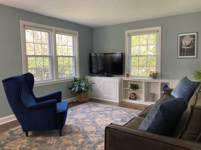 59 Overlook Dr, Manchester, CT 06042 - living area featuring healthy amount of natural light, wood finished floors, and baseboards