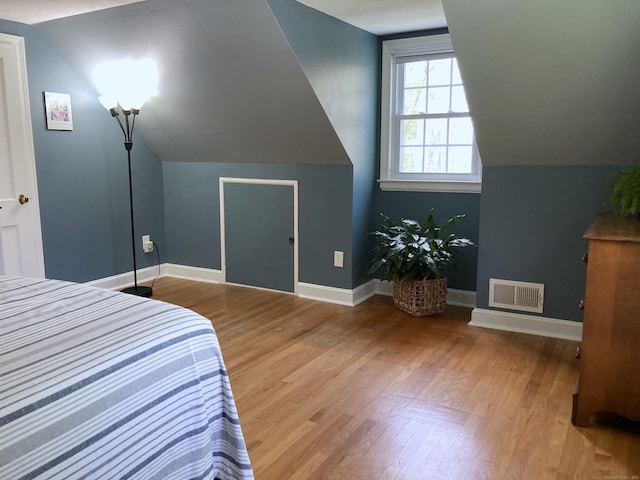 59 Overlook Dr, Manchester, CT 06042 - bedroom featuring wood finished floors, vaulted ceiling, and baseboards