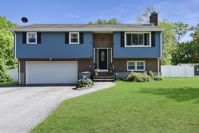 90 Redwood Dr, Bristol, CT 06010 - raised ranch with asphalt driveway, a chimney, an attached garage, and brick siding
